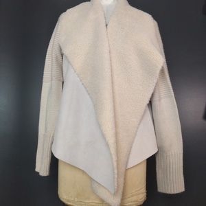 Assymmetrical hem white faux fur sweater